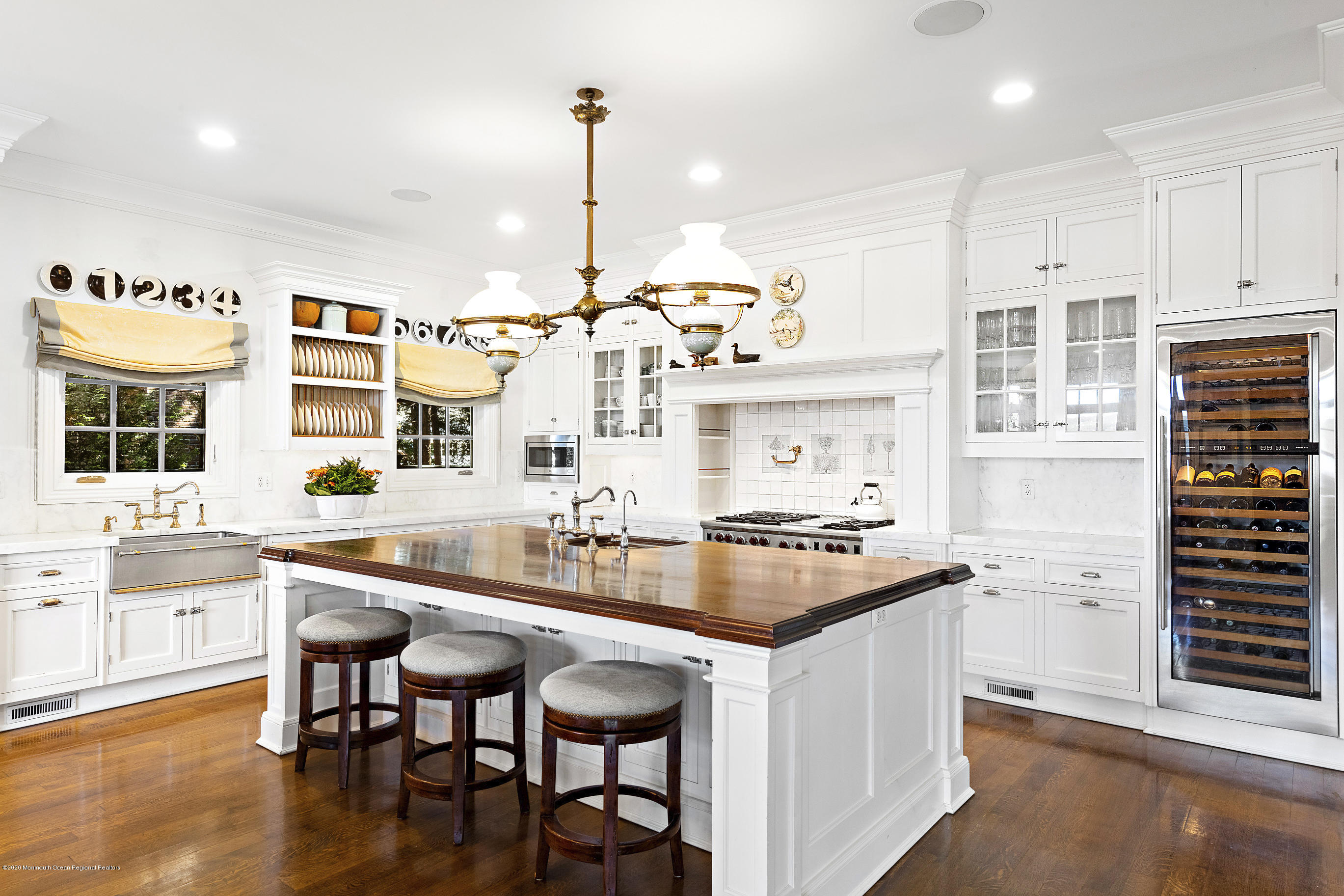 62 River Road Rumson, NJ 07760 - Photo 22 of 54 a kitchen with granite countertop a sink and cabinets