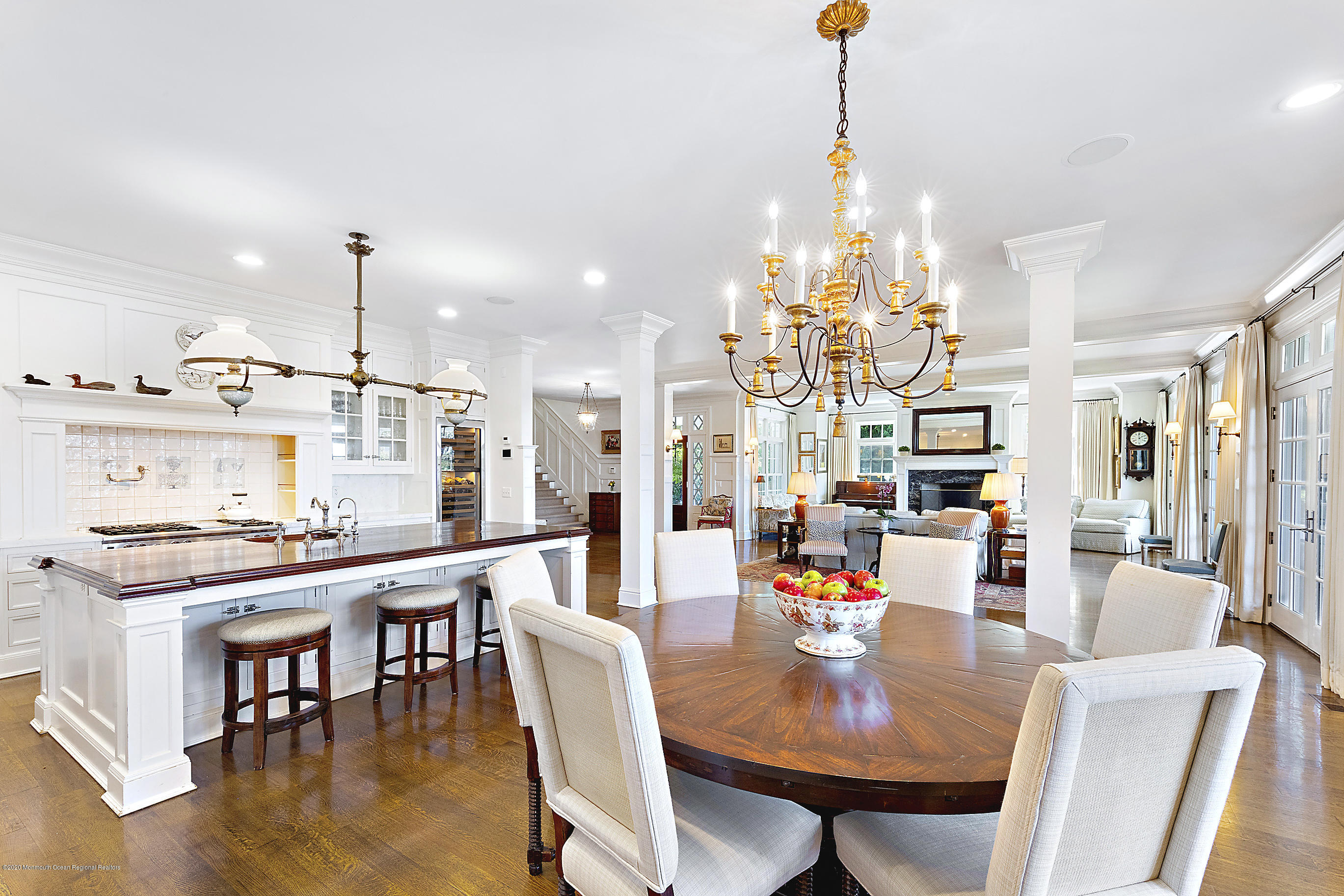 62 River Road Rumson, NJ 07760 - Photo 23 of 54 a view of a dining room and livingroom with furniture wooden floor a chandelier