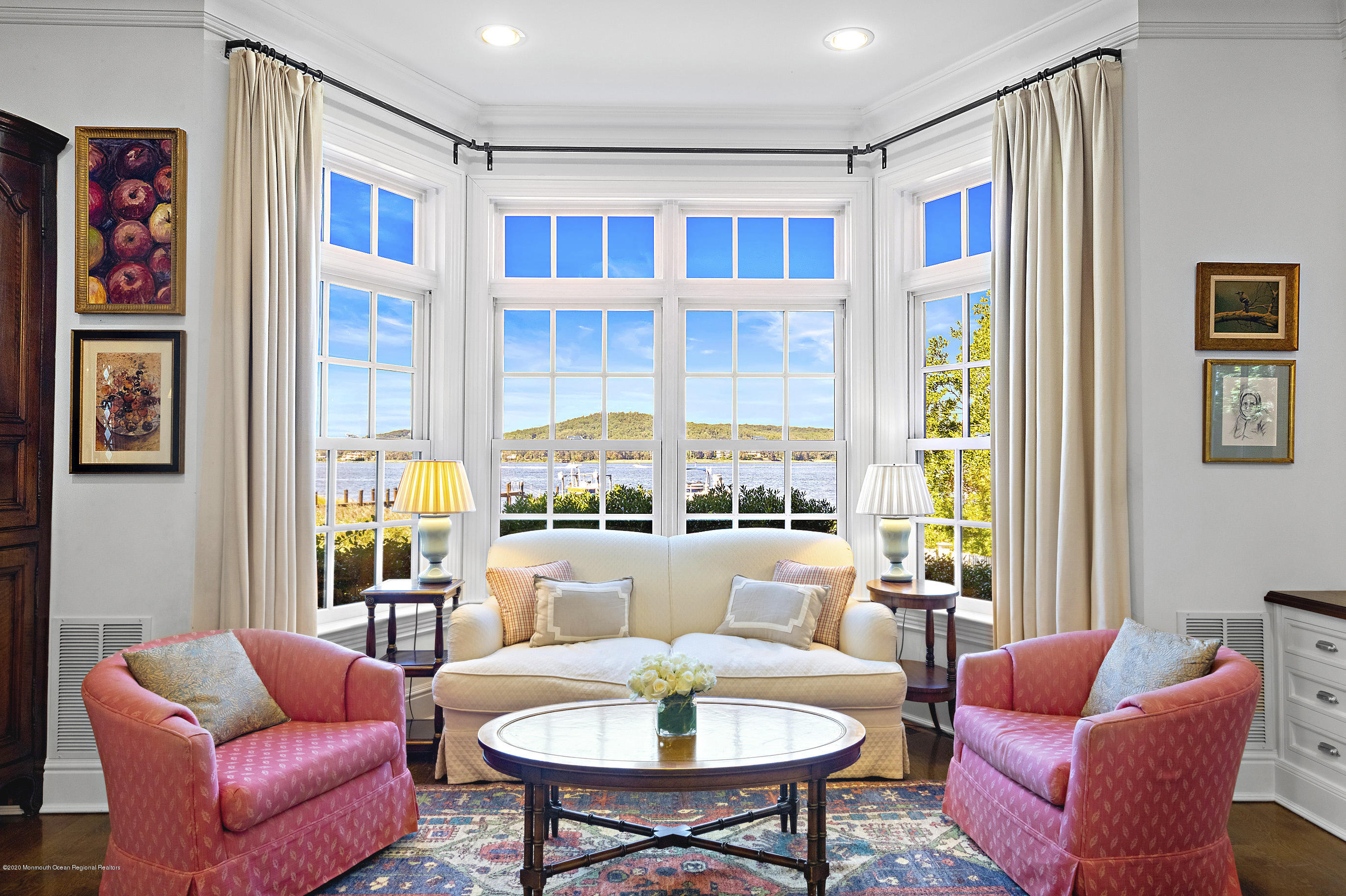 62 River Road Rumson, NJ 07760 - Photo 25 of 54 a living room with furniture a table and a large window