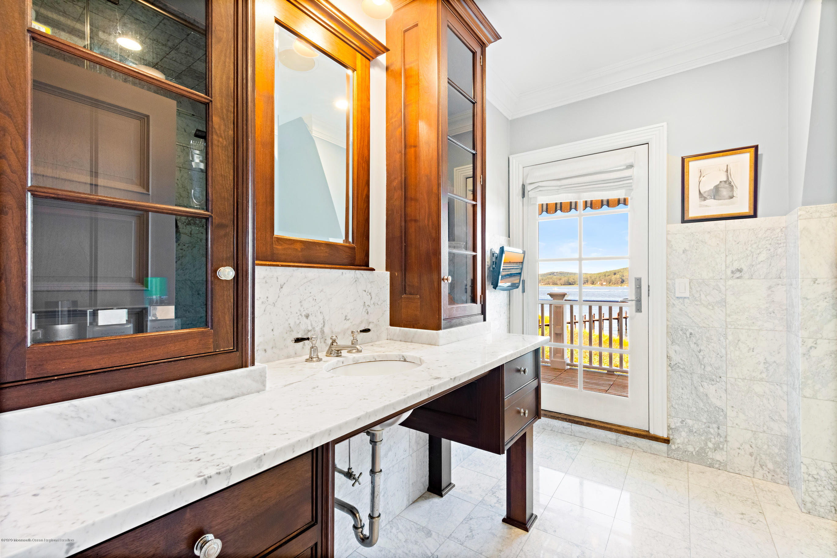 62 River Road Rumson, NJ 07760 - Photo 35 of 54 a room with a large window and a wooden floor