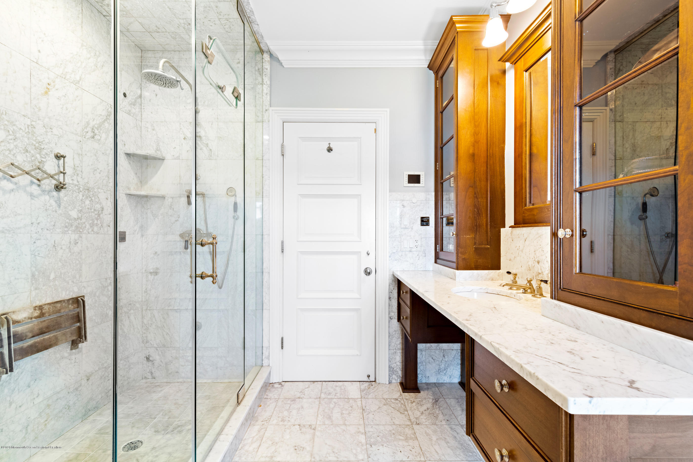 62 River Road Rumson, NJ 07760 - Photo 36 of 54 a bathroom with a granite countertop shower sink and mirror