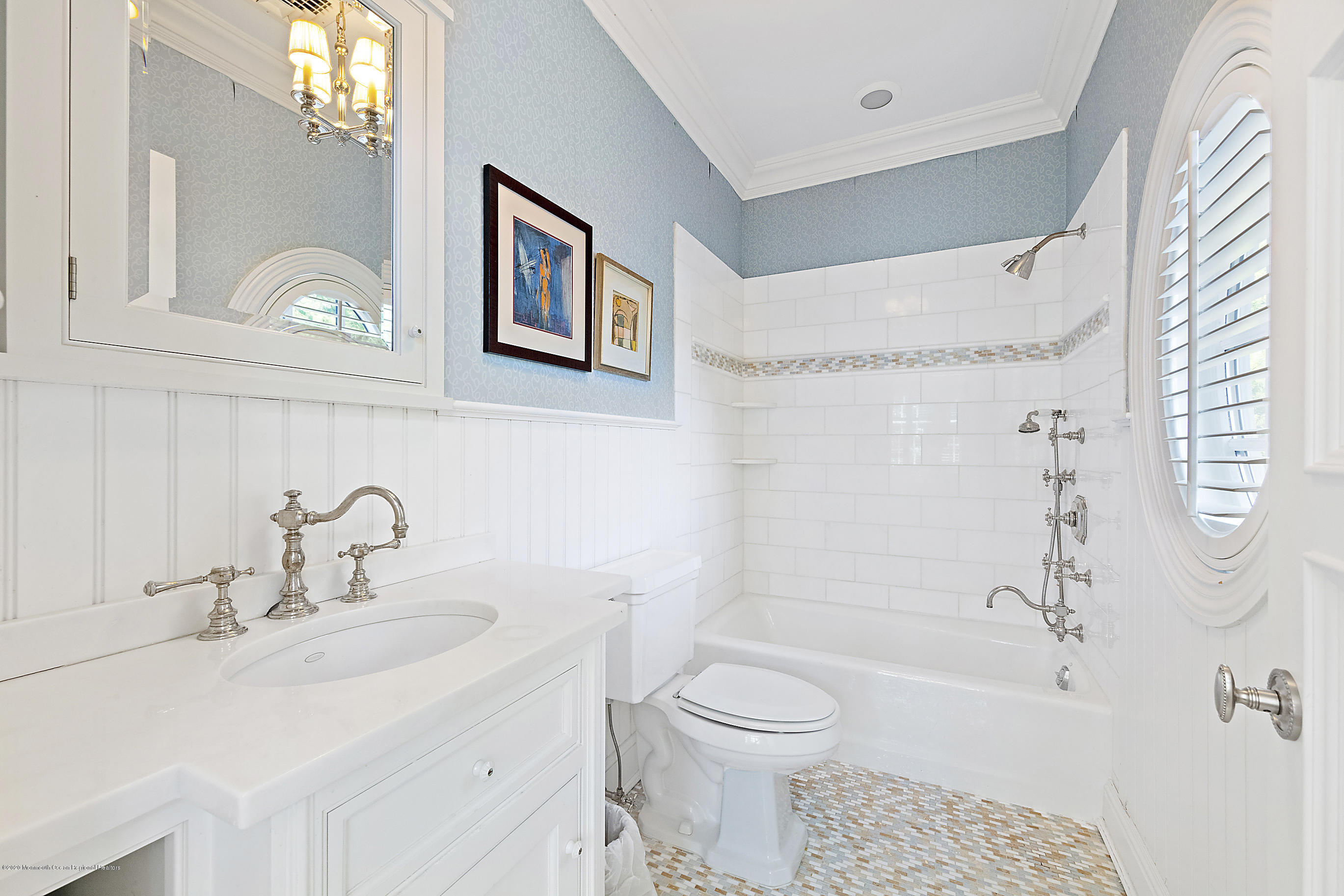 62 River Road Rumson, NJ 07760 - Photo 37 of 54 a bathroom with a sink a toilet and a bathtub