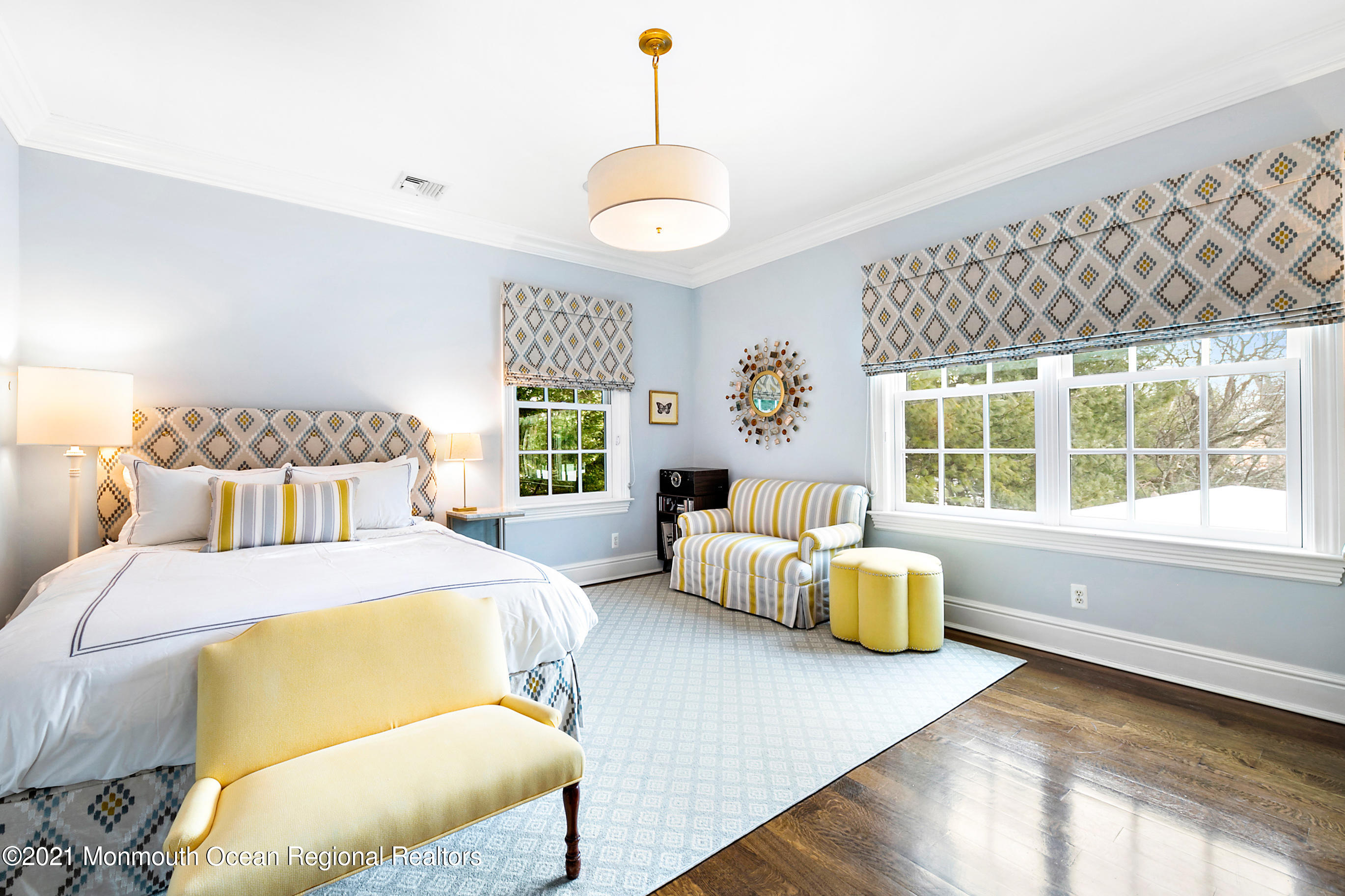 62 River Road Rumson, NJ 07760 - Photo 38 of 54 a bedroom with a bed and a large window