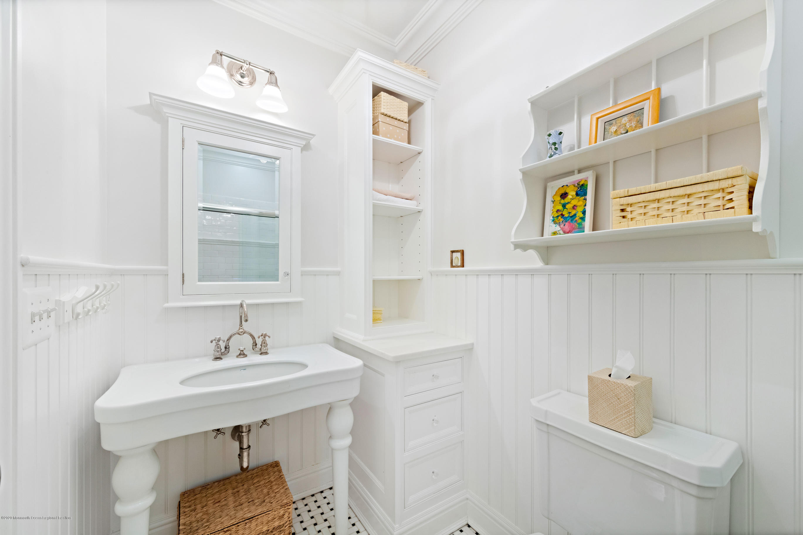 62 River Road Rumson, NJ 07760 - Photo 42 of 54 a bathroom with a sink and a mirror