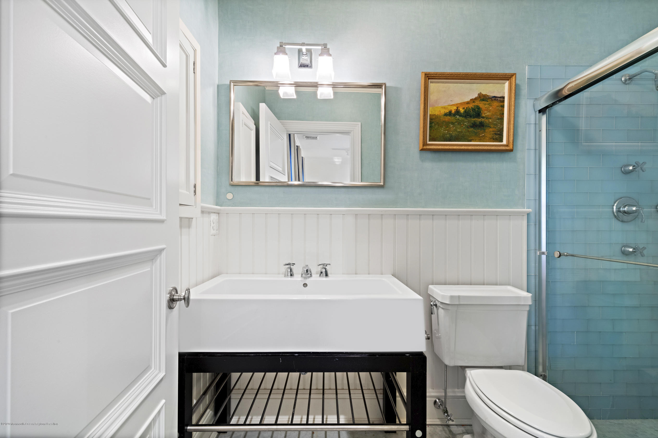 62 River Road Rumson, NJ 07760 - Photo 44 of 54 a bathroom with a sink a mirror and a toilet