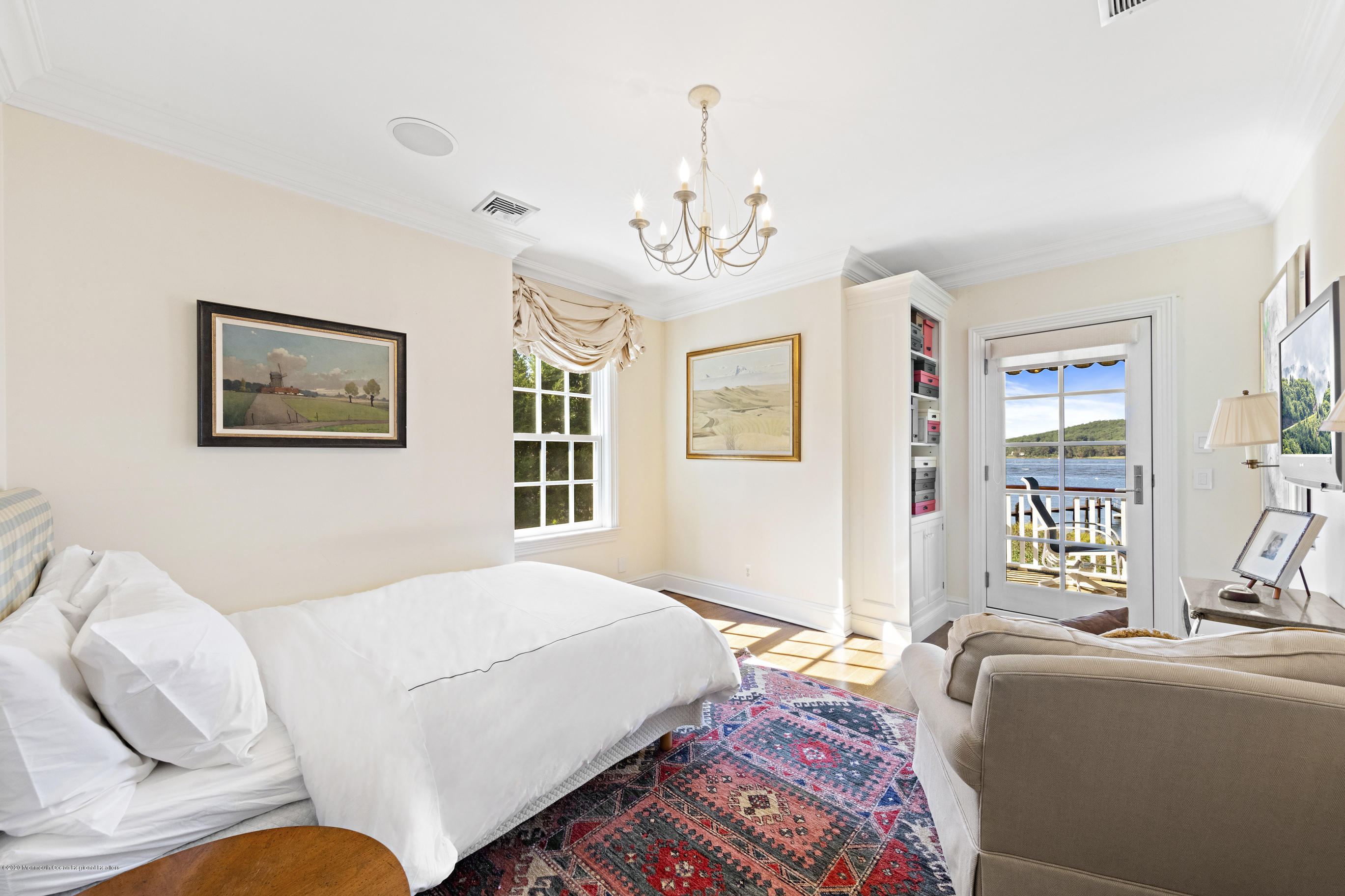 62 River Road Rumson, NJ 07760 - Photo 48 of 54 a bedroom with a bed couch and a window