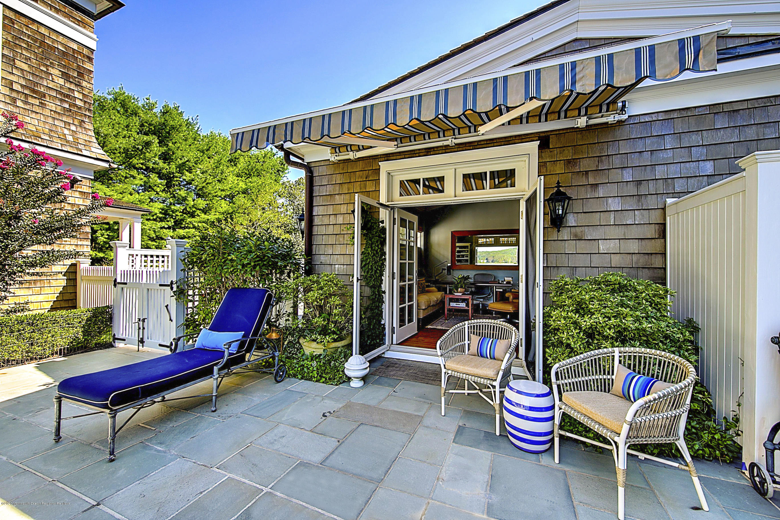 62 River Road Rumson, NJ 07760 - Photo 51 of 54 a view of a backyard with sitting area and furniture
