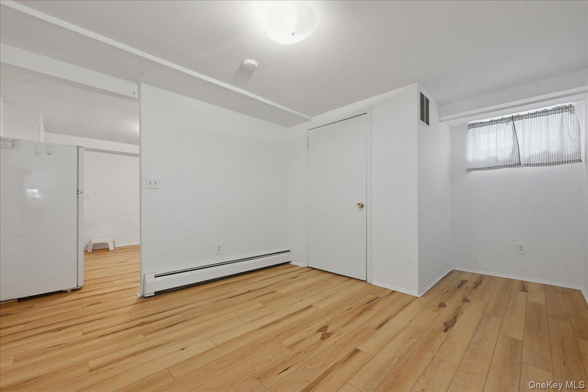 17 Avon Road Farmingdale, NY 11735 - Photo 29 of 46 wooden floor in an empty room