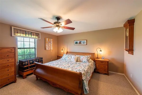 a view of a house with backyard sitting area and garden