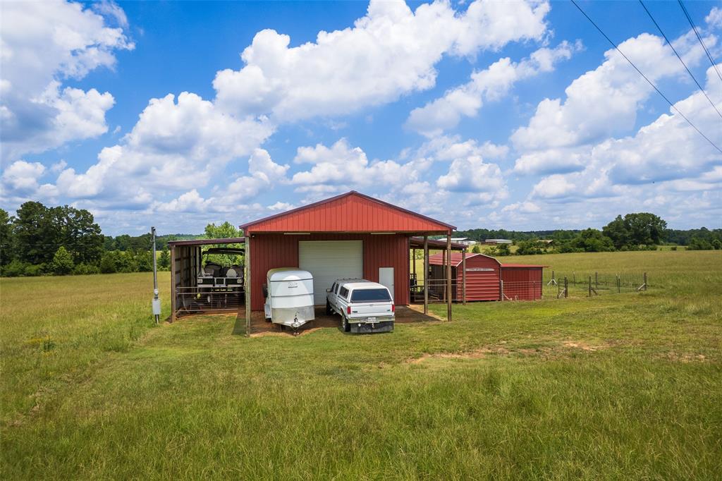 6888 Fm 2888 Naples, TX 75568 - Photo 17 of 40 a view of a house with a yard