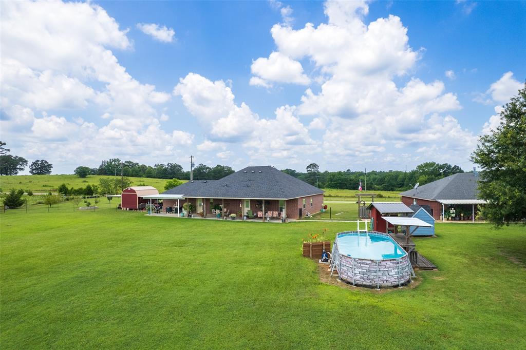 6888 Fm 2888 Naples, TX 75568 - Photo 18 of 40 a view of a house with a yard