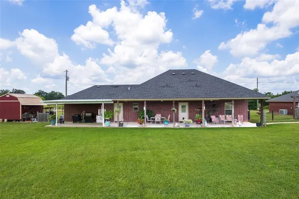 a view of an house with a big yard