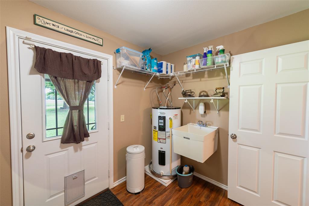 6888 Fm 2888 Naples, TX 75568 - Photo 23 of 40 a room with a refrigerator and cabinets