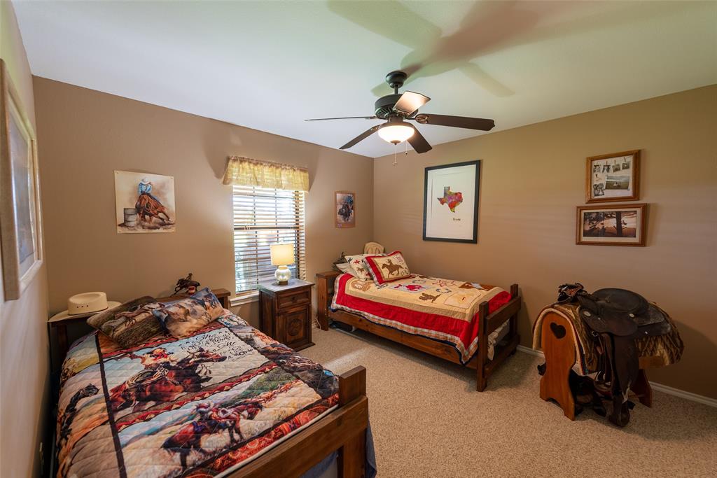 6888 Fm 2888 Naples, TX 75568 - Photo 25 of 40 a bedroom with bed and a window