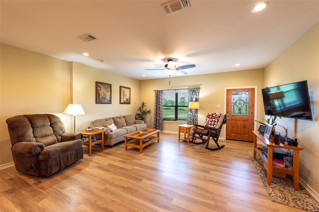 6888 Fm 2888 Naples, TX 75568 - Photo 35 of 40 a living room with furniture and a flat screen tv