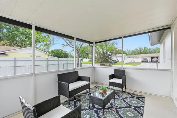 a living room with large windows