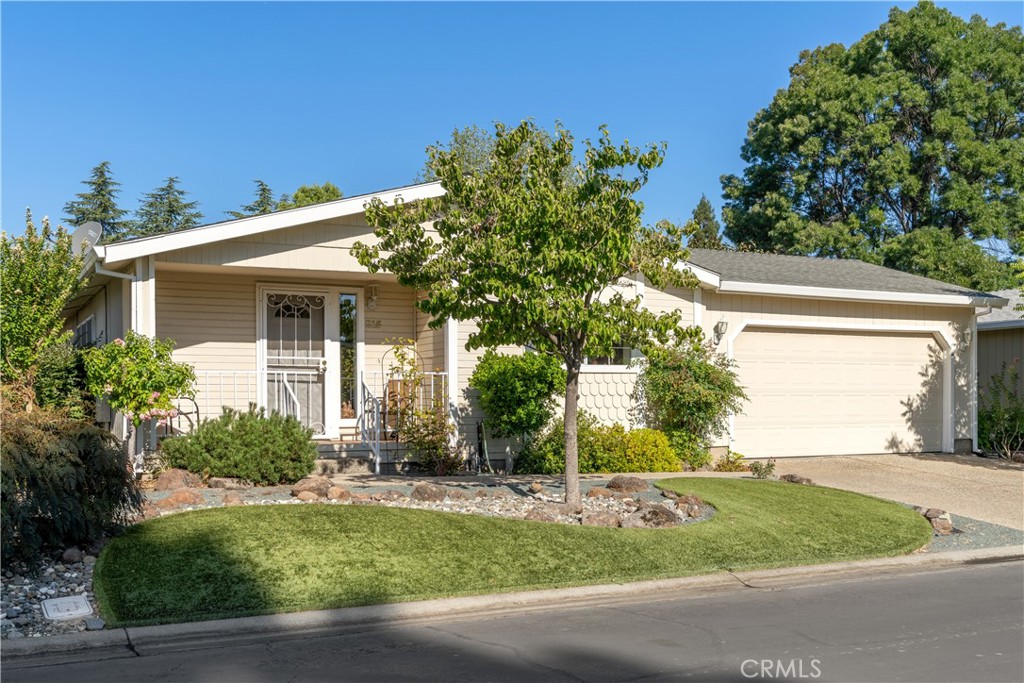 a front view of a house with garden