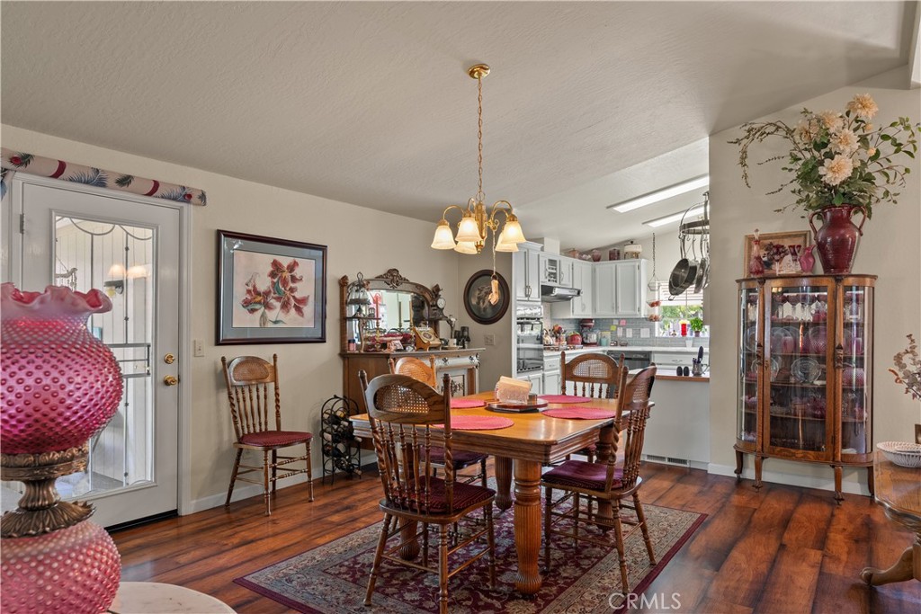 2050 Springfield Drive, Unit 215 Chico, CA 95928 - Photo 12 of 53 a view of a dining room with furniture and wooden floor