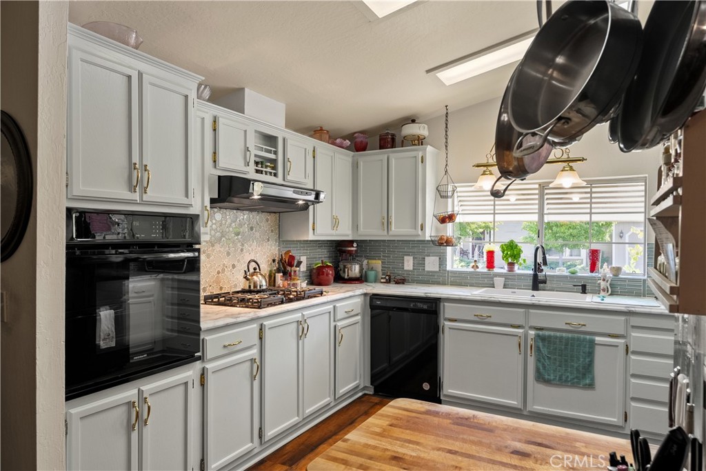 2050 Springfield Drive, Unit 215 Chico, CA 95928 - Photo 14 of 53 a kitchen with stainless steel appliances granite countertop a sink a stove and cabinets