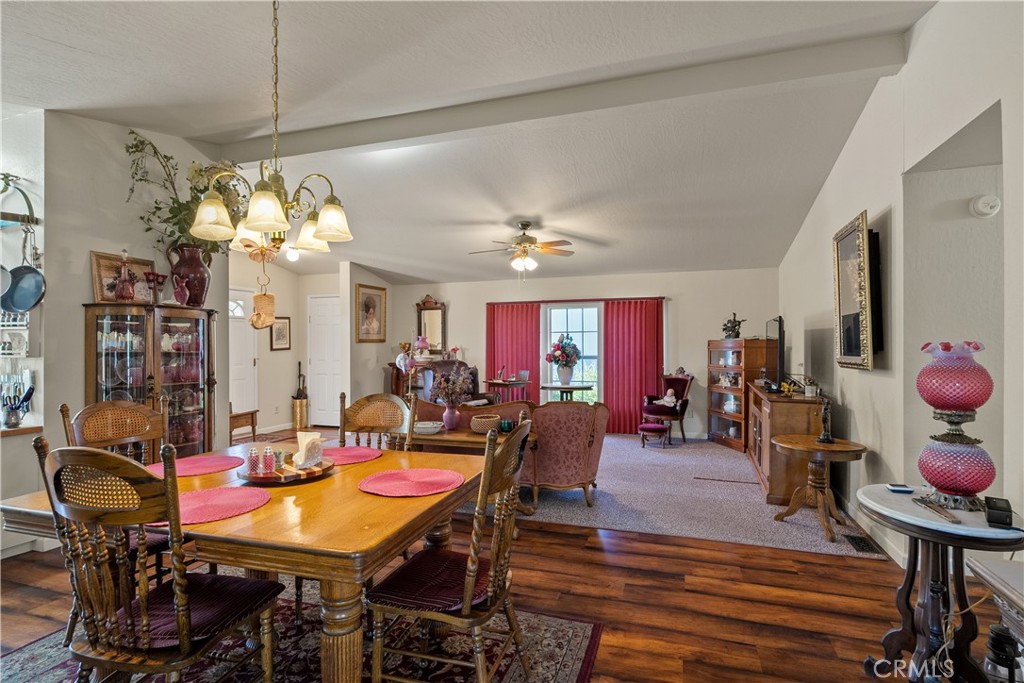 2050 Springfield Drive, Unit 215 Chico, CA 95928 - Photo 15 of 53 a view of a dining room with furniture and chandelier