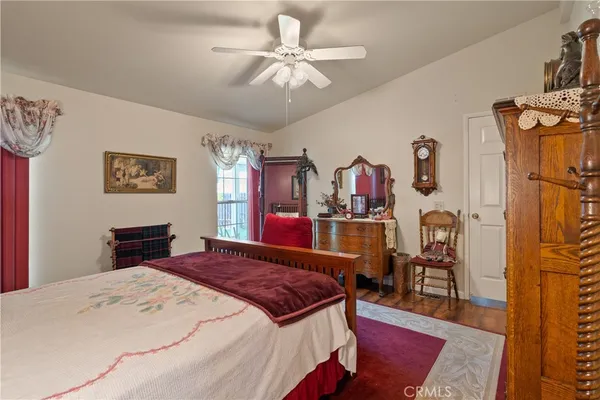 a bed room with a bed and a chandelier
