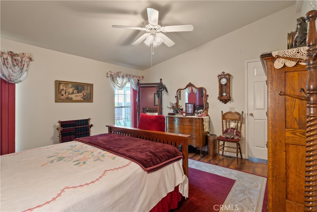 2050 Springfield Drive, Unit 215 Chico, CA 95928 - Photo 19 of 53 a bed room with a bed and a chandelier