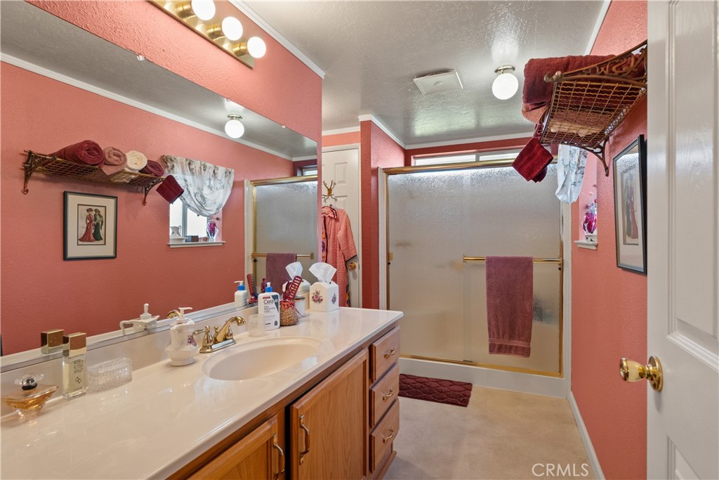 2050 Springfield Drive, Unit 215 Chico, CA 95928 - Photo 20 of 53 a bathroom with a sink and mirror
