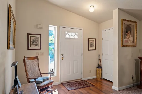a view of room with walk in closet and wooden floor