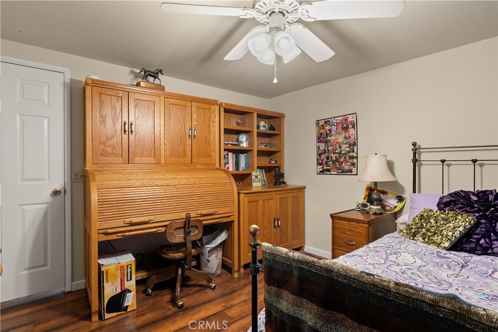 2050 Springfield Drive, Unit 215 Chico, CA 95928 - Photo 24 of 53 a bedroom with a bed and a chandelier