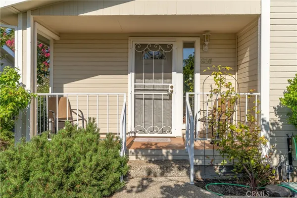 a view of house with a yard
