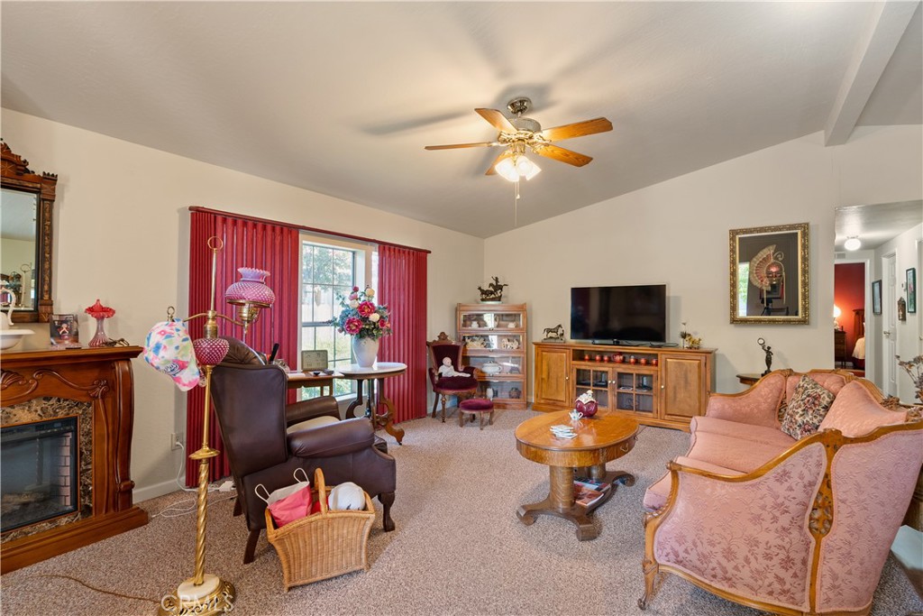 2050 Springfield Drive, Unit 215 Chico, CA 95928 - Photo 4 of 53 a living room with furniture and a flat screen tv