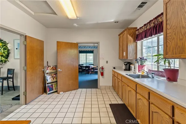 a kitchen with stainless steel appliances a refrigerator and a stove top oven