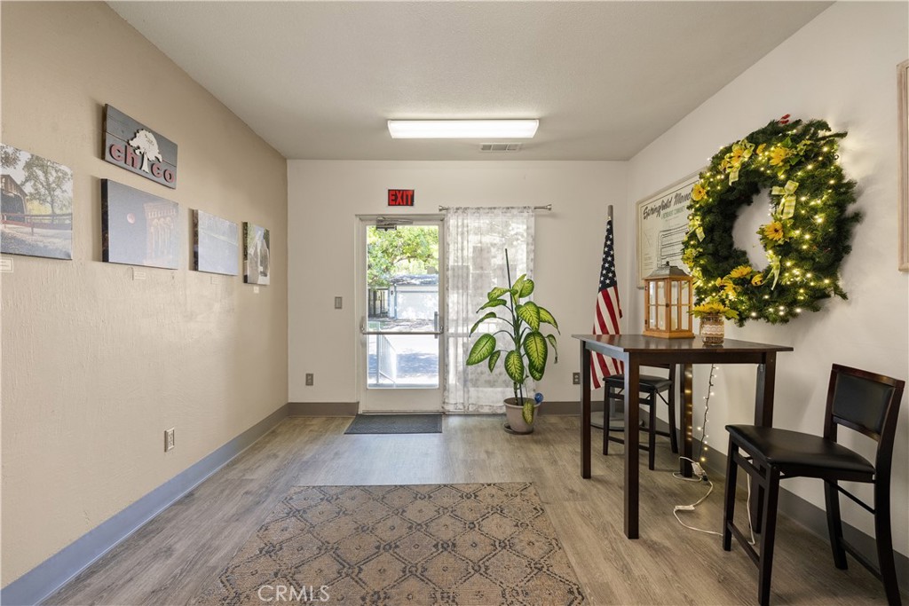 2050 Springfield Drive, Unit 215 Chico, CA 95928 - Photo 43 of 53 a view of a dining room with furniture and a potted plant