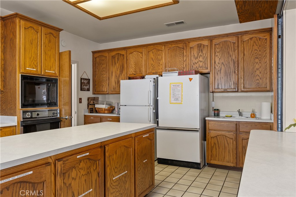 2050 Springfield Drive, Unit 215 Chico, CA 95928 - Photo 45 of 53 a kitchen with stainless steel appliances a refrigerator and a stove top oven