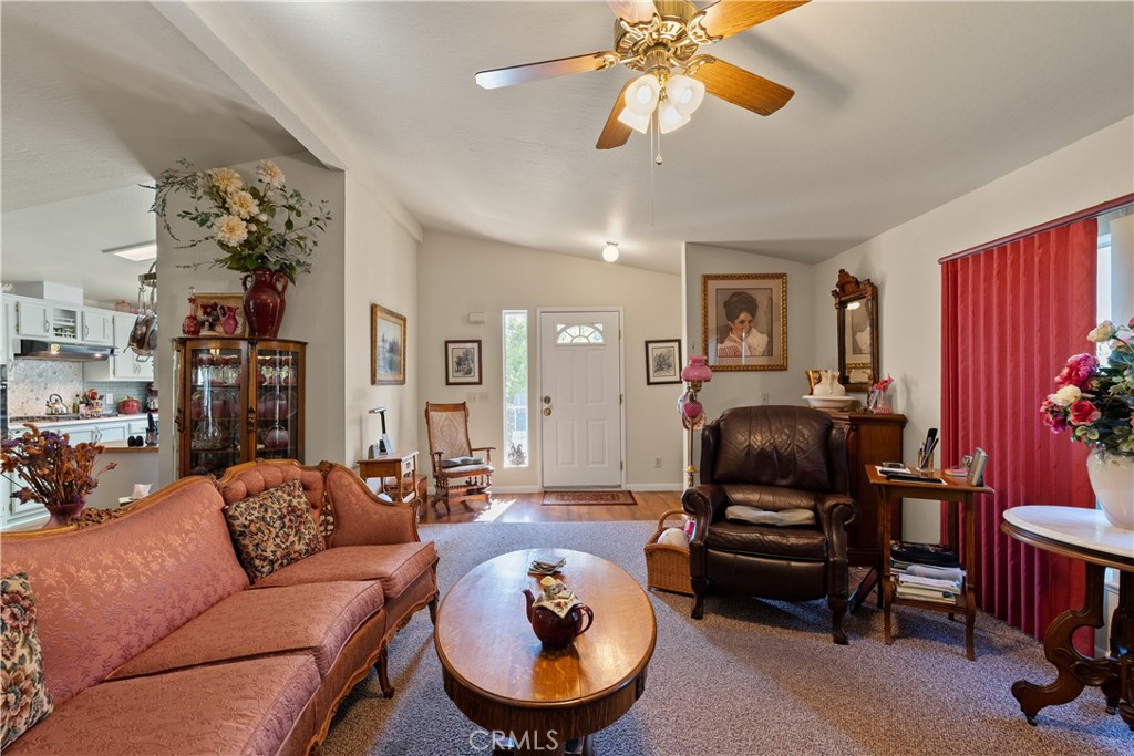 2050 Springfield Drive, Unit 215 Chico, CA 95928 - Photo 9 of 53 a living room with furniture a ceiling fan and a window