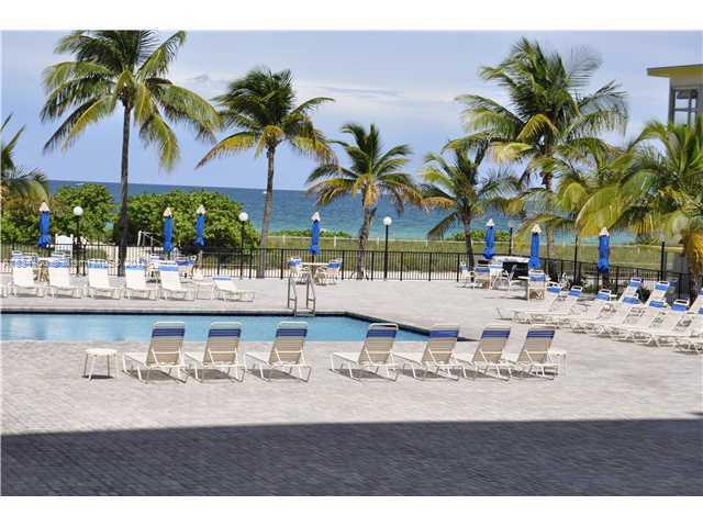 9273 Collins Avenue, Unit 503 Surfside, FL 33154 - Photo 6 of 14 a view of multiple houses with swimming pool
