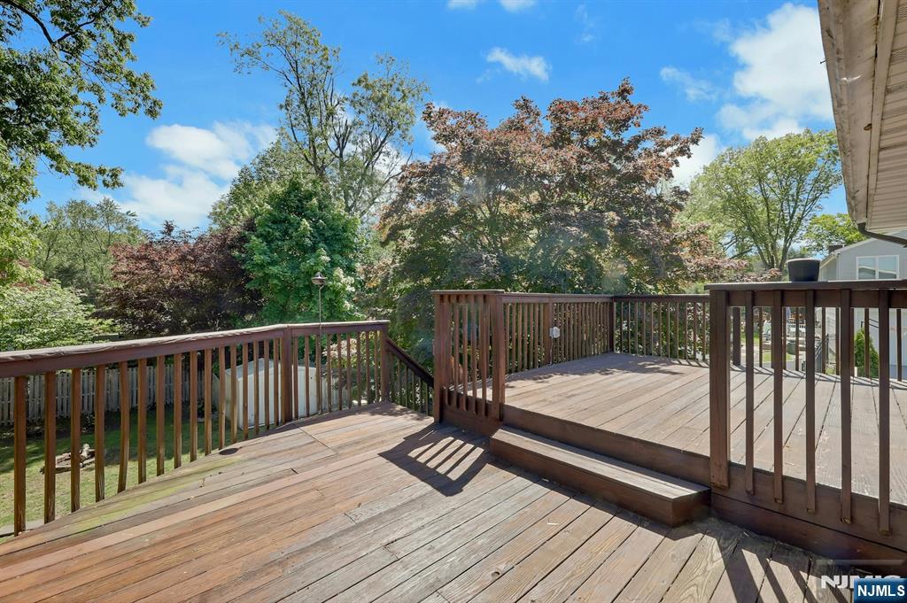 20 Blue Hill Road Norwood, NJ 07648 - Photo 44 of 49 a view of deck with wooden floor and outdoor seating