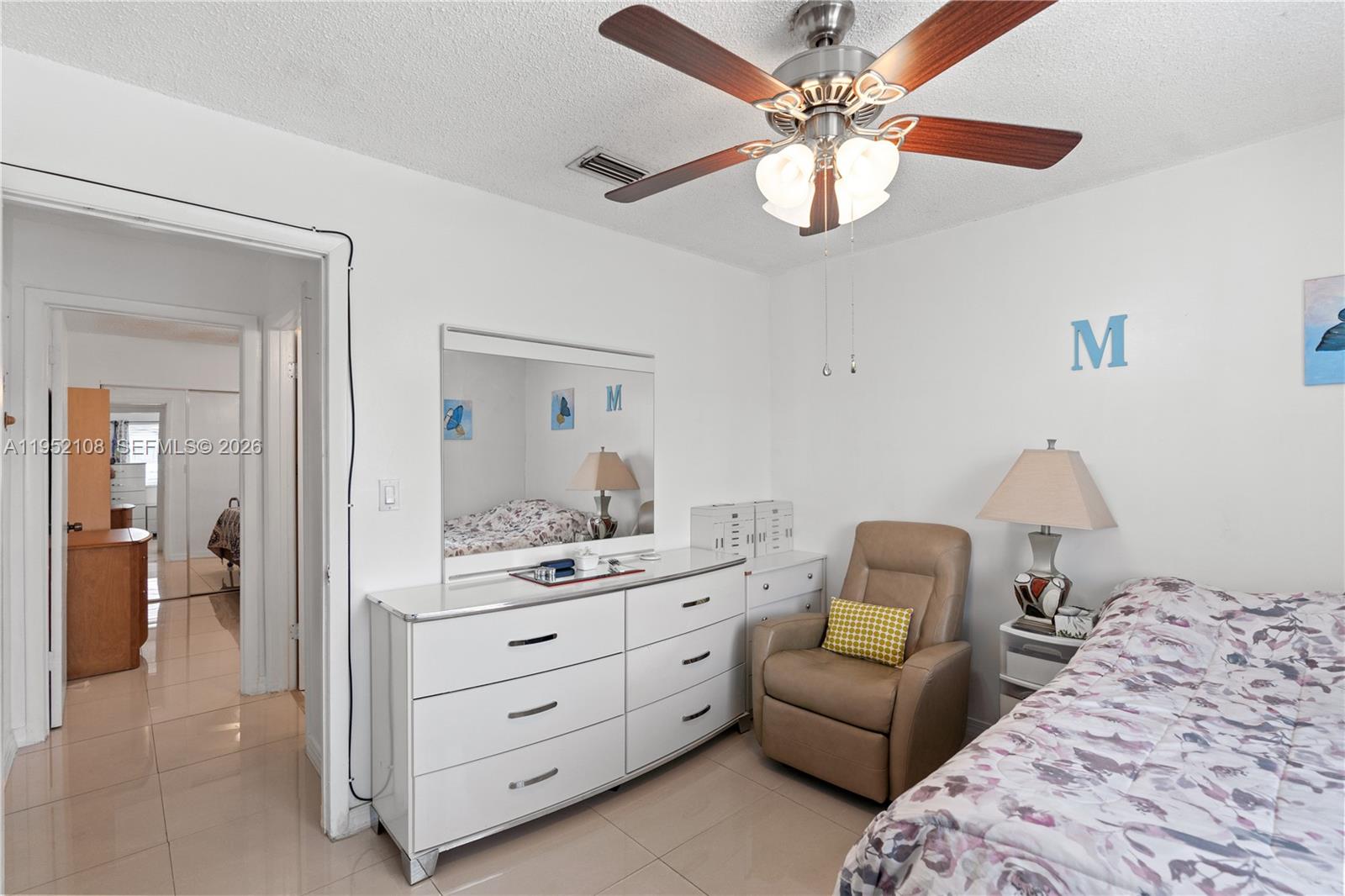 6919 West 29th Way Hialeah, FL 33018 - Photo 16 of 23 a living room with furniture and a chandelier