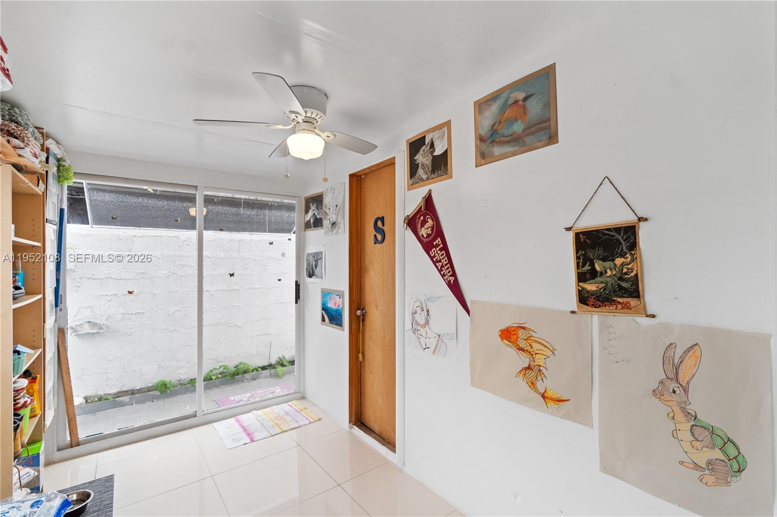 6919 West 29th Way Hialeah, FL 33018 - Photo 19 of 23 a view of a hallway with windows and entryway