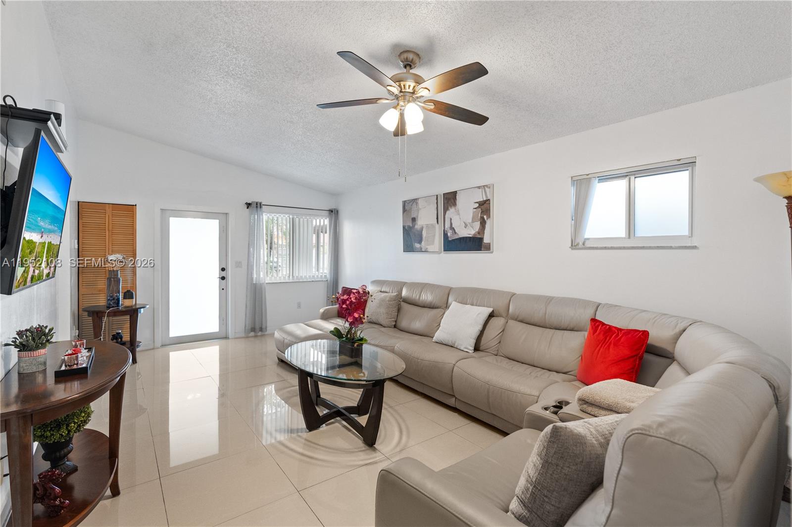 6919 West 29th Way Hialeah, FL 33018 - Photo 4 of 23 a living room with furniture and white walls
