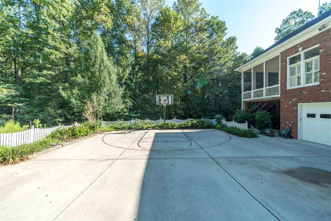 7233 Kemp Road Raleigh, NC 27613 - Photo 17 of 25 Parking Pad with BBall Goal