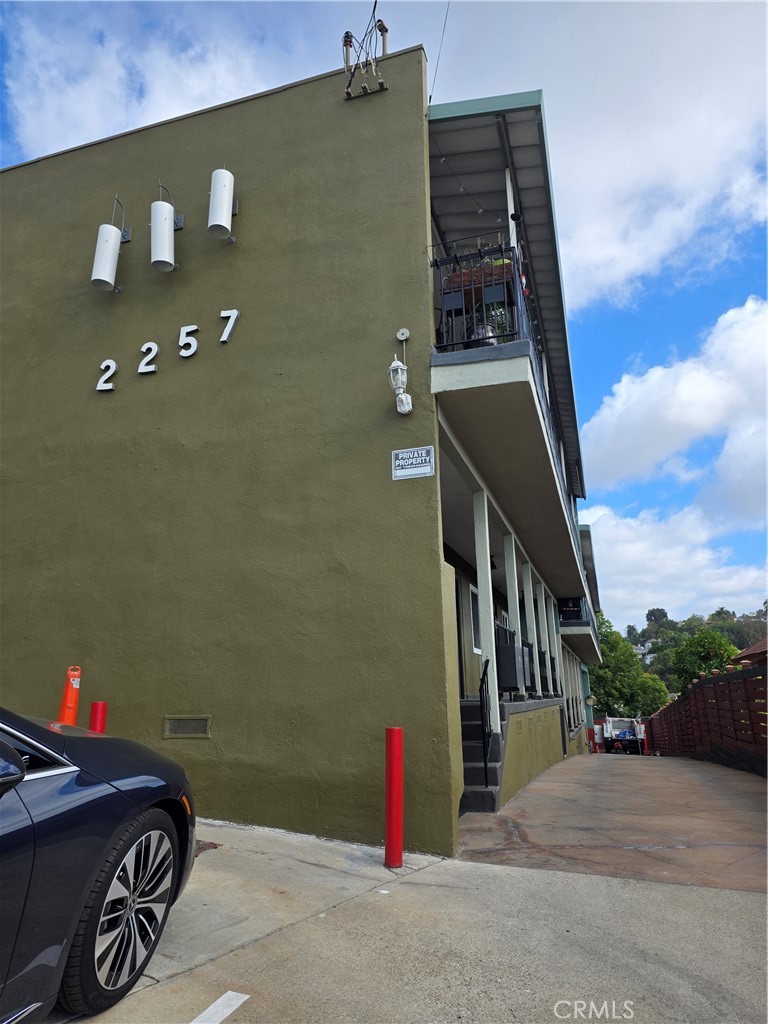 a view of a car park in front of a building