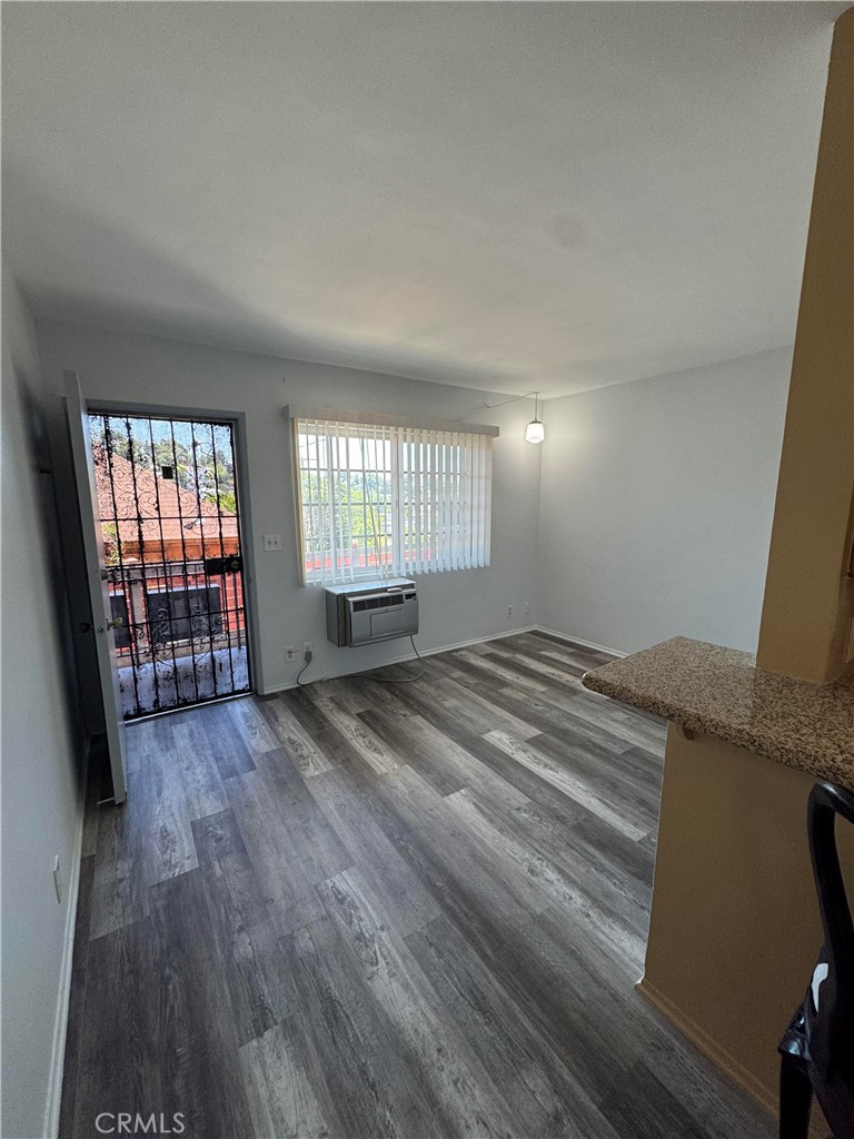 2257 Ewing Street, Unit 1 Los Angeles, CA 90039 - Photo 3 of 8 wooden floor in an empty room with a window