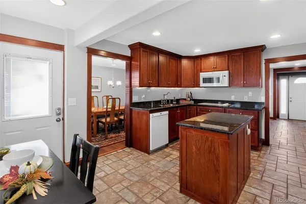 a kitchen with a stove top oven sink and cabinets