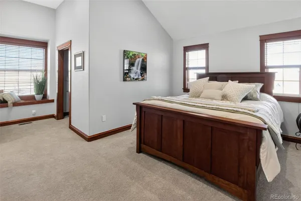 a bedroom with a bed and a cabinets