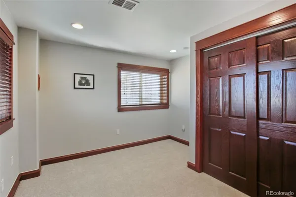 a view of an empty room with windows