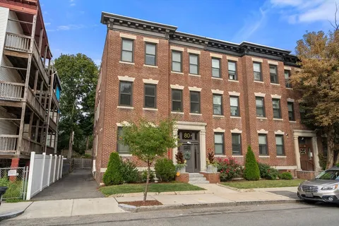 a front view of a building with street view