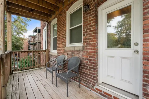 a balcony view with a outdoor seating space