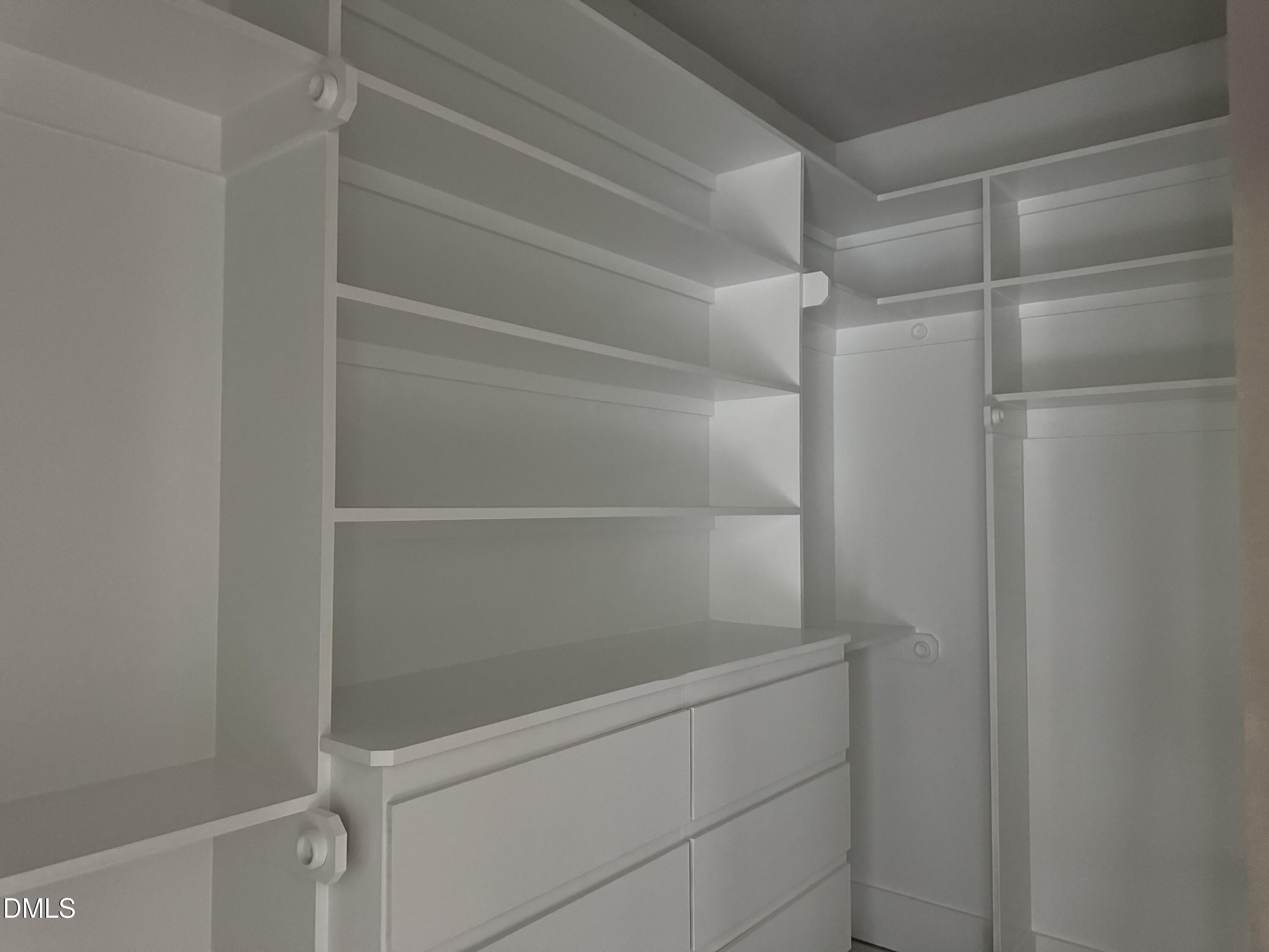 935 Lynch Road Selma, NC 27576 - Photo 11 of 21 a view of walk in closet with empty racks