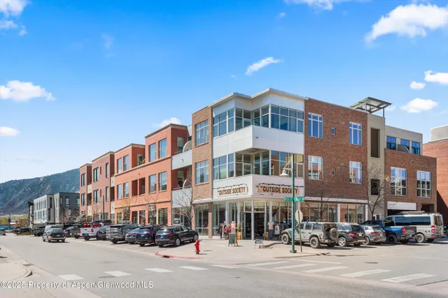 a front view of a building with street view